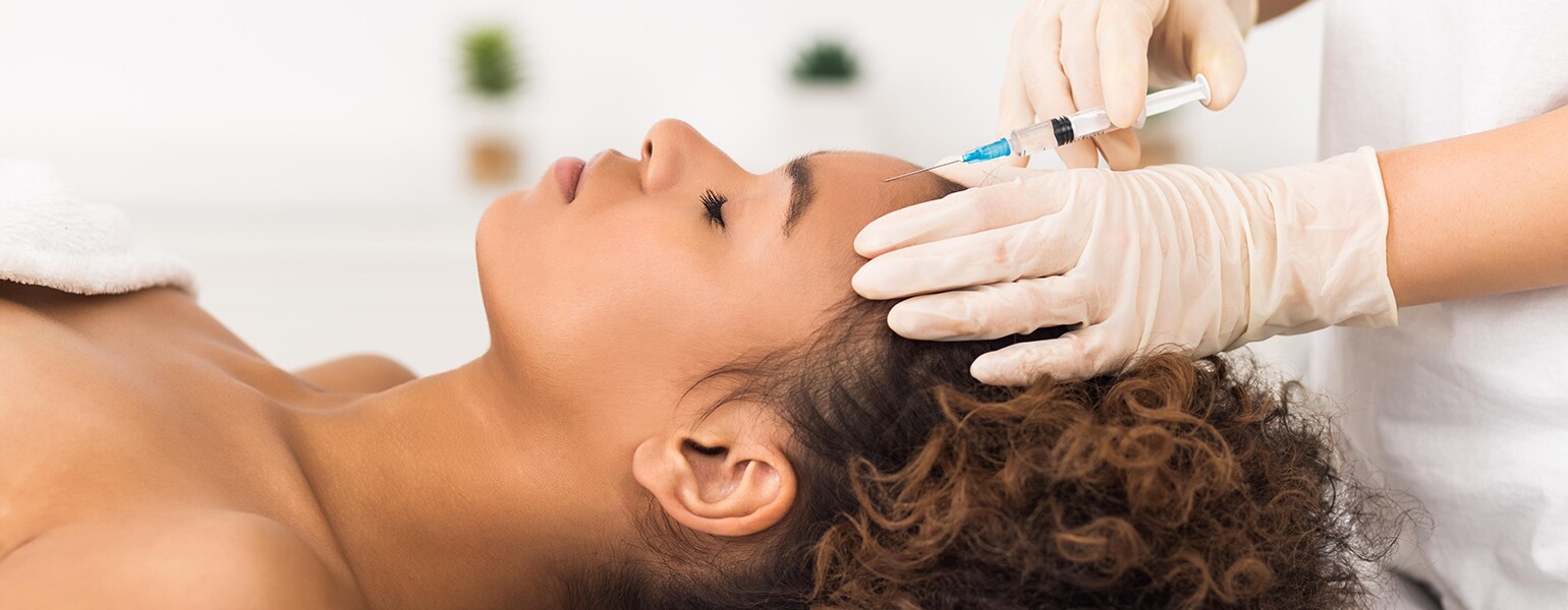 image_of_black_woman_getting_medi_spa_treatment_RRXEAW_1540.jpg