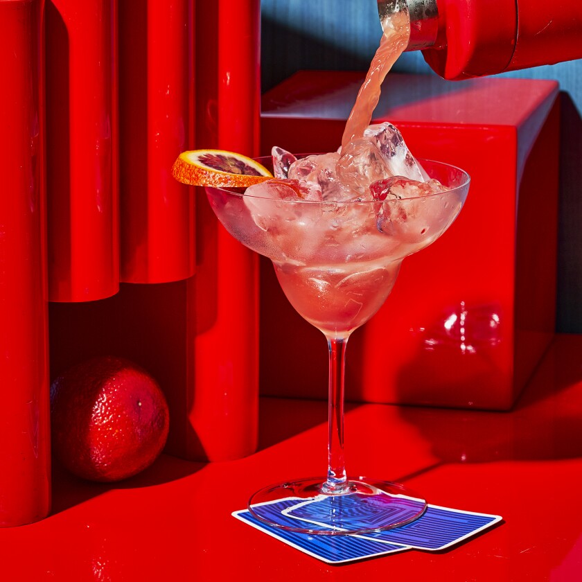 Blood Orange and Pomegranate Margarita on a colorful background