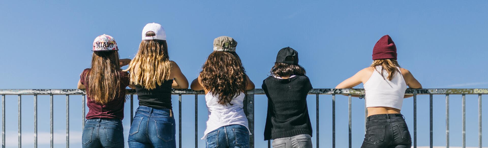 Back View Of A Group Of Stylish Teen Girls