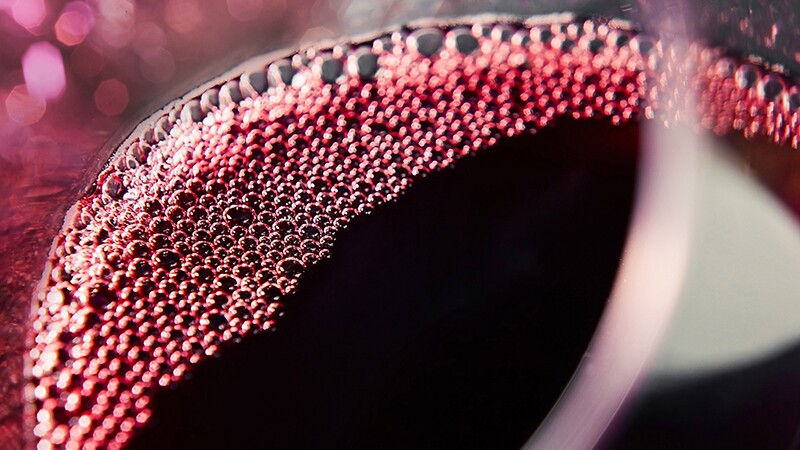 A close-up view of red wine in a glass