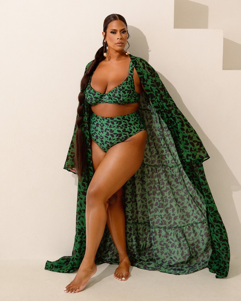Woman in matching green two piece and beach robe
