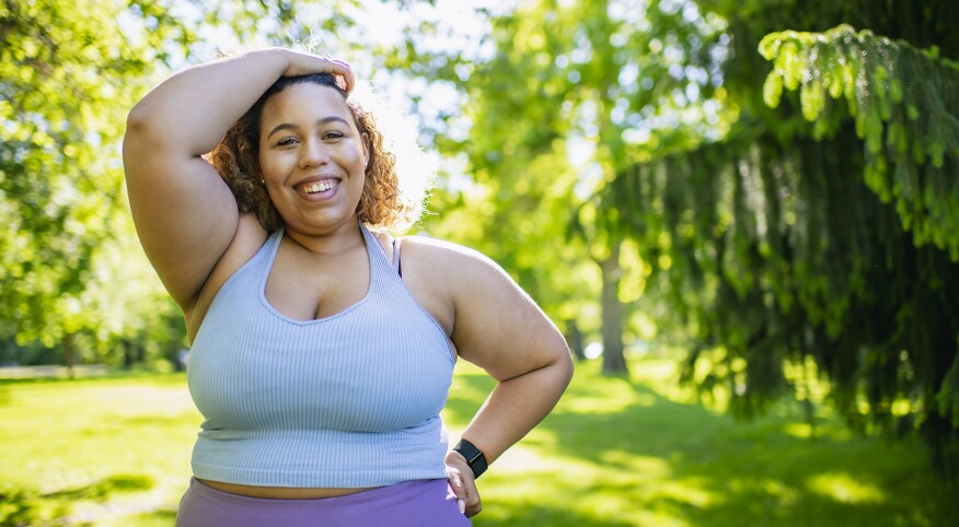 image_of_happy_full_figure_woman_standing_outside_GettyImages-1332206495_1800