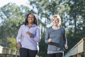 Two women speed walking