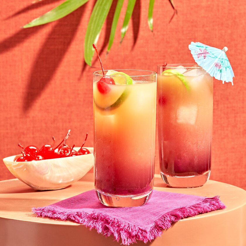 Summer sunset cocktail styled with colorful props