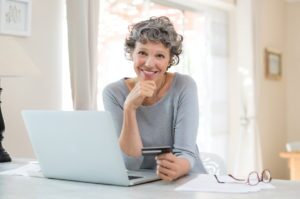 Woman shopping online for last minute holiday gifts