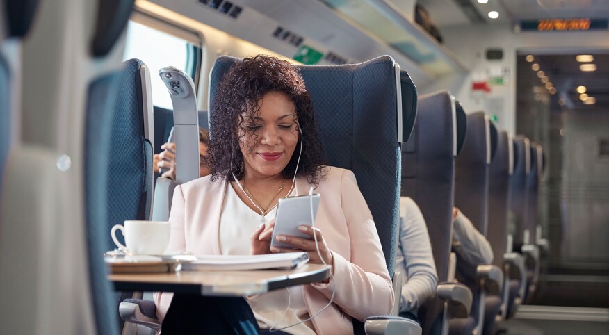 image_of_black_woman_on_train_using_phone_GettyImages-939658760_1540.jpg