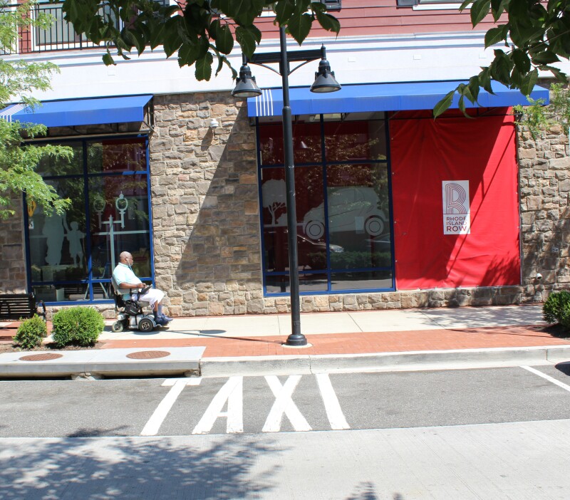 Pedestrian in motorized chair