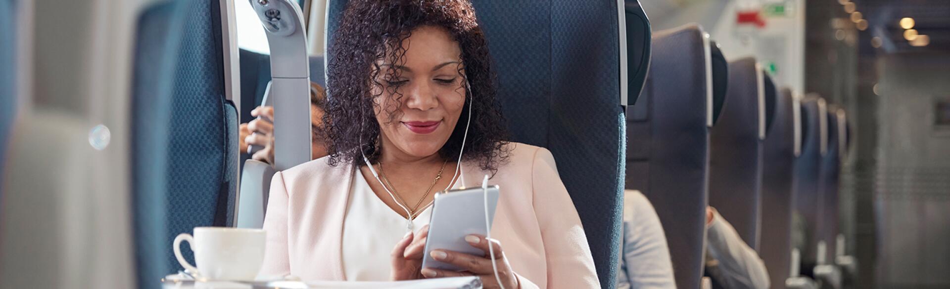 image_of_black_woman_on_train_using_phone_GettyImages-939658760_1540.jpg