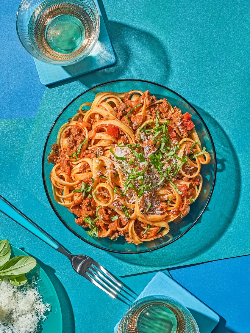 Easy one pot busy day pasta seen from above on a teal background