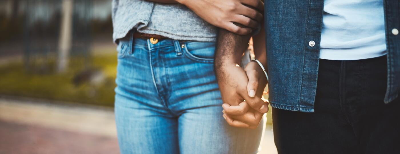woman and mans hands interlocked