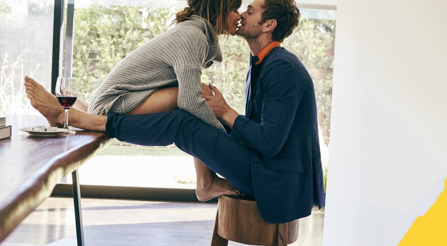 couple kissing inside their home