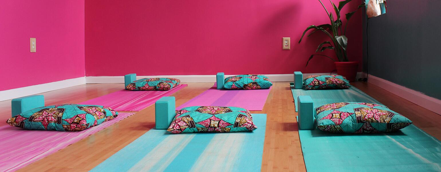 Yoga studio with mats on the floor.