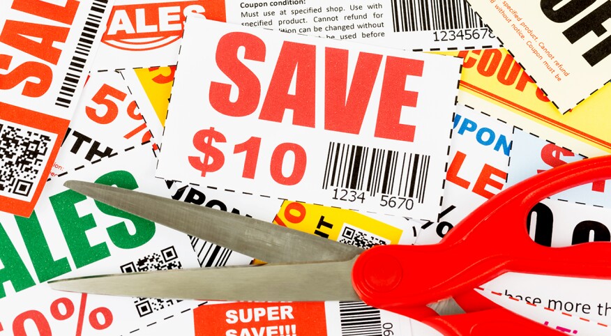 Group of coupons with red scissors