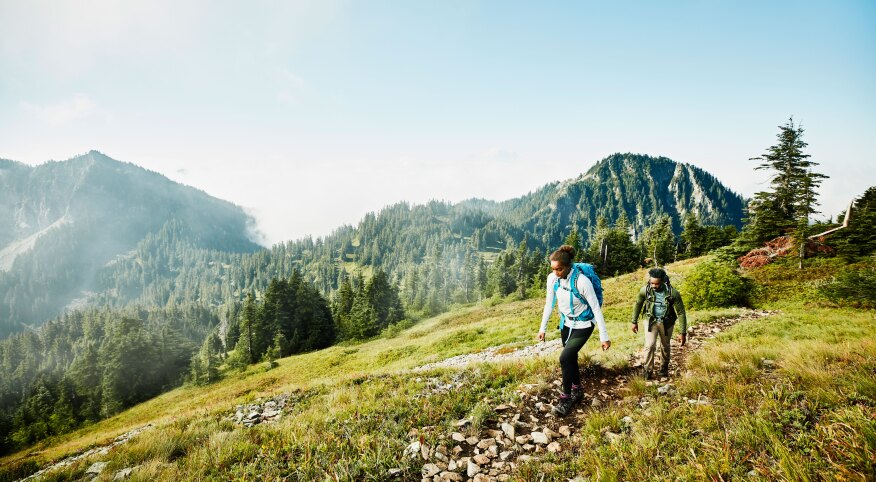 Female and male hiking in the mountains