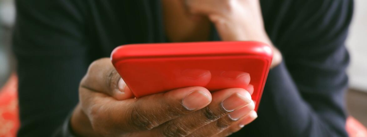Woman holding her phone