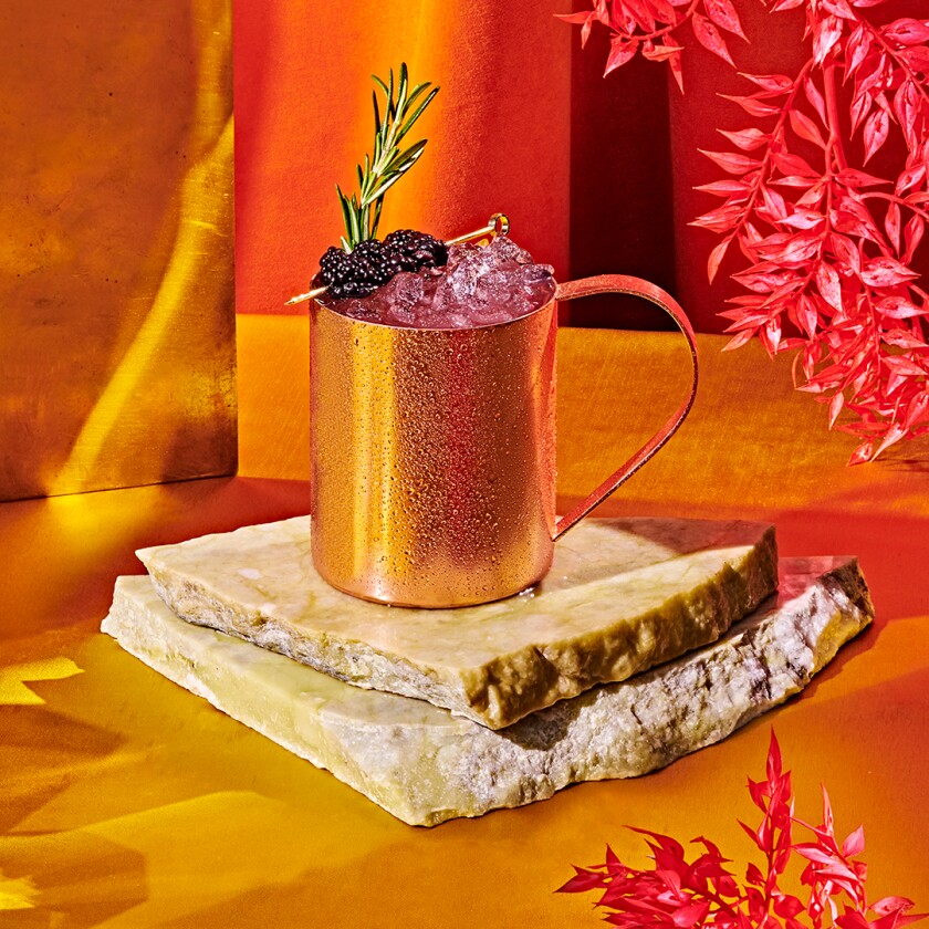 Beautiful Roseberry Mule mocktail photographed in a warm orange light