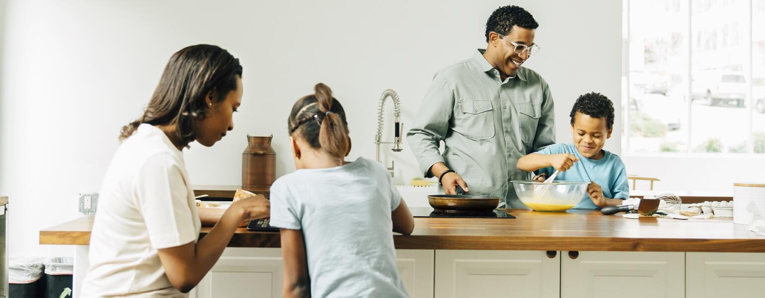 Family cooking in kitchen