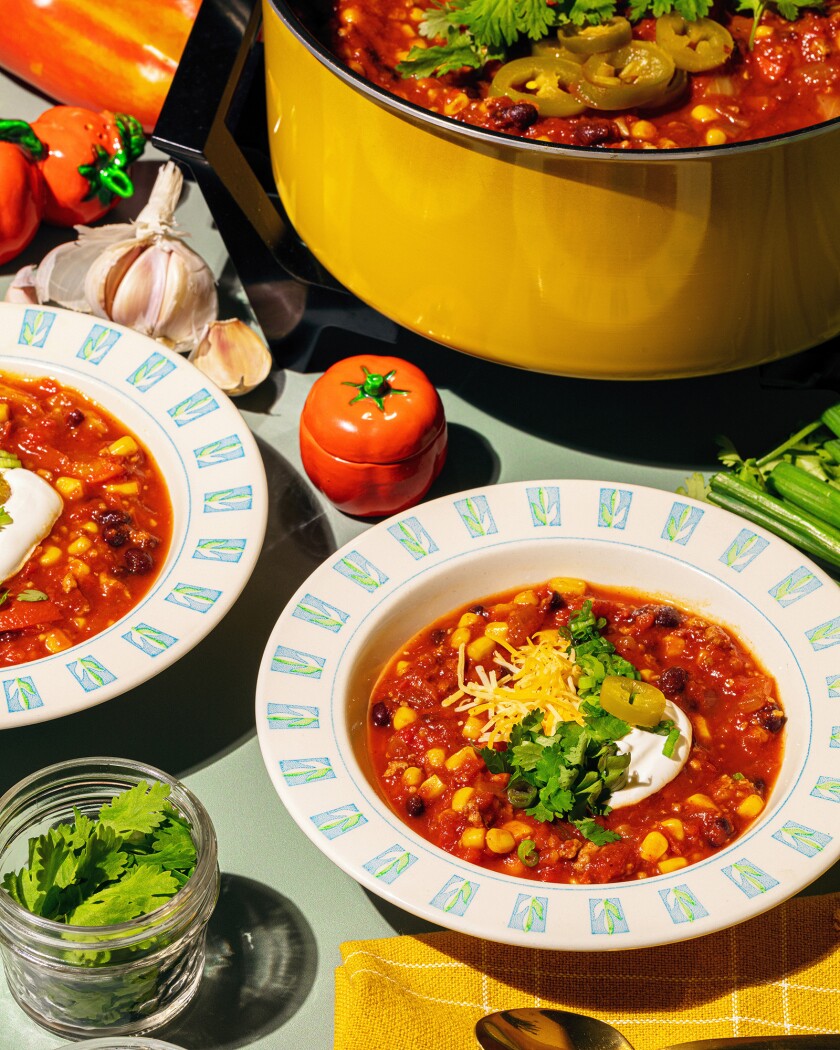 Overhead shot of turkey chili with yellow crockpot