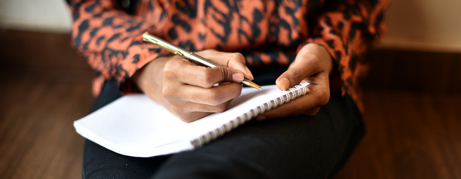 image_of_womans_hands_writing_in_notebook_GettyImages-1020523958_1540.jpg