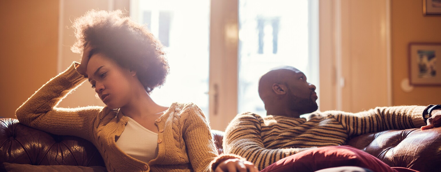 photo_of_upset_black_woman_on_couch_with_black_man_GettyImages-485953996_1540