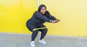 image_of_woman_doing_squats_exercise_GettyImages-1361760550_1800