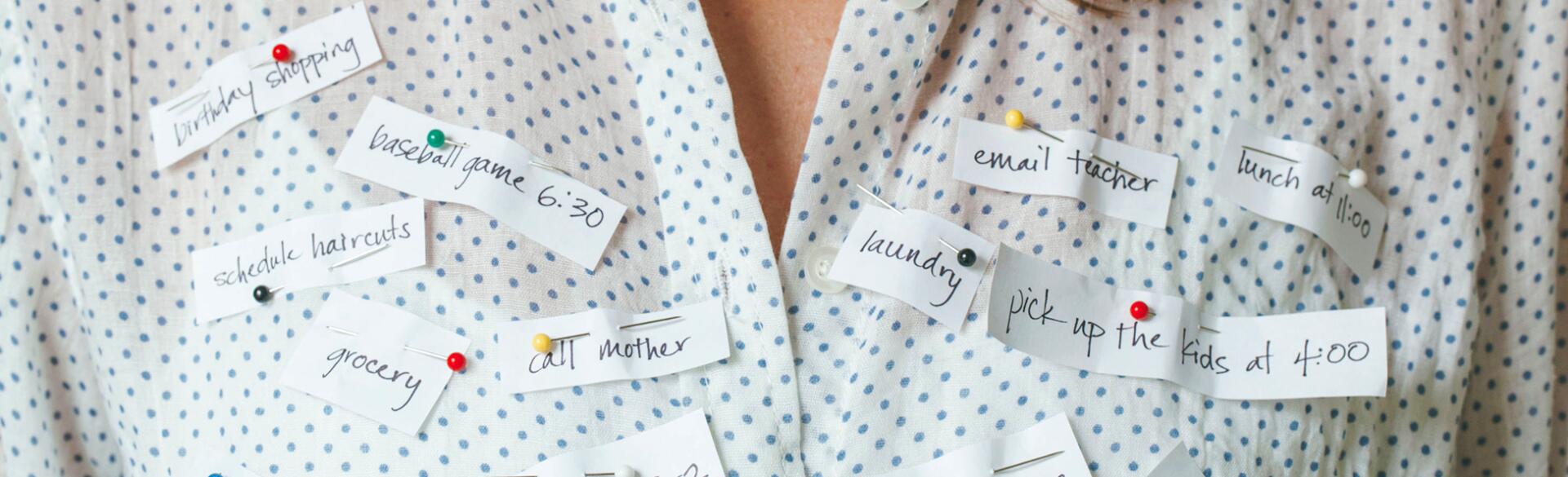 Busy Woman With Reminders Pinned To Her Shirt