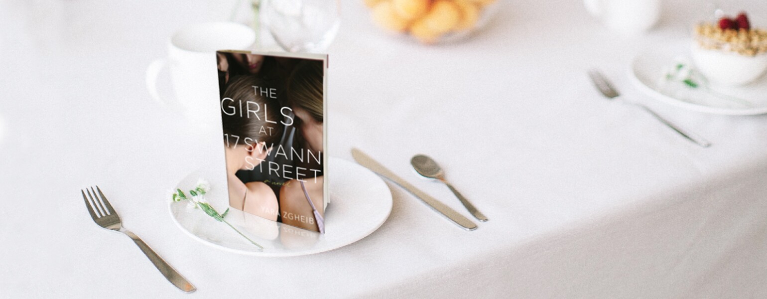 An image of Yara Zgheib's new novel, The Girls at 17 Swann Street, staged on a dining table.