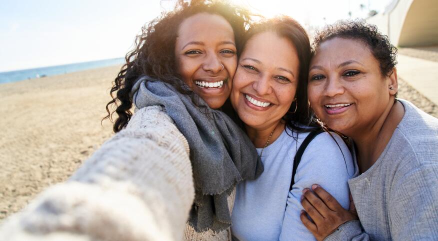 Selfie of happy family in the beach.