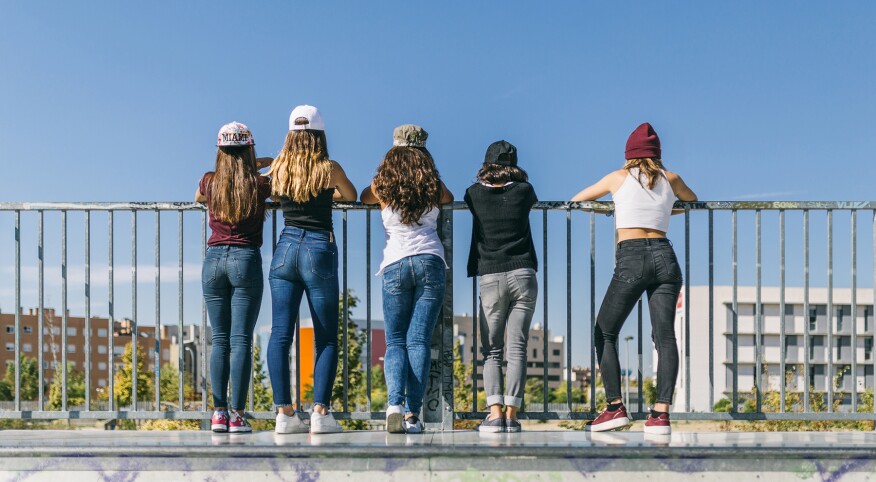 Back View Of A Group Of Stylish Teen Girls
