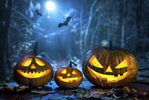 Halloween pumpkin head jack lantern with burning candles