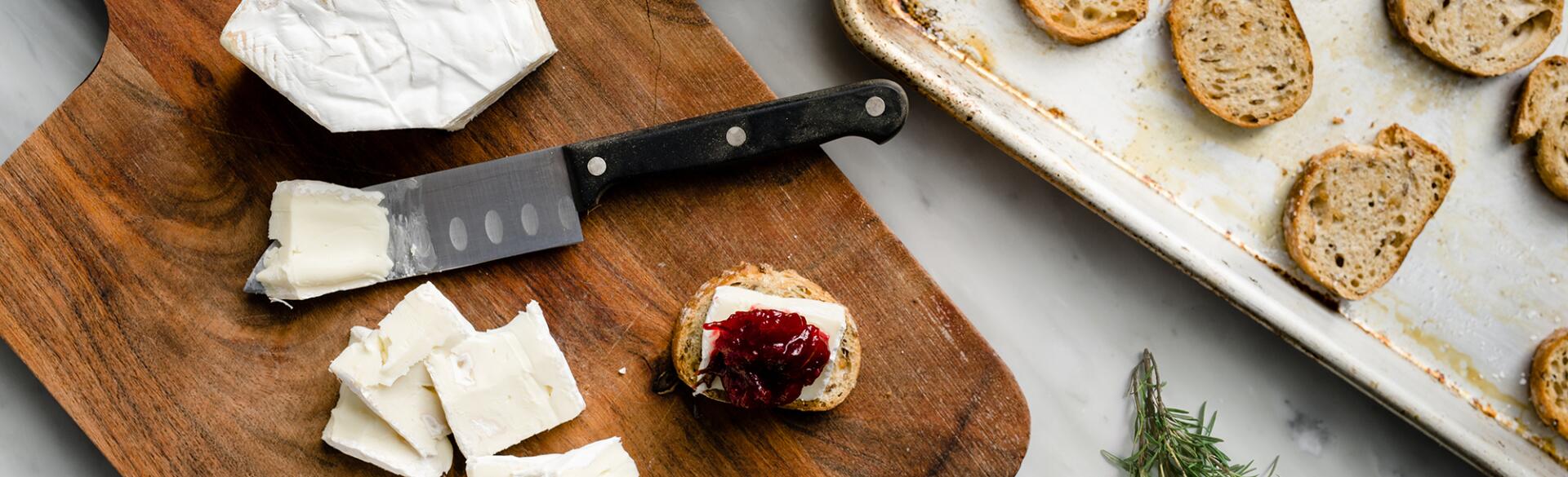 Making Cranberry Brie Toast Bites easy appetizer for a girls night in