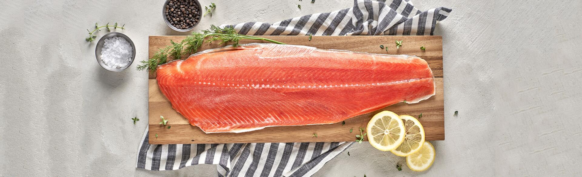 salmon filet on wooden slab shown for brain food