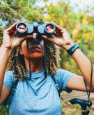 Black woman birdwatching