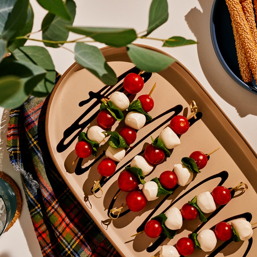 View of four easy appetizers with wintery plaid background