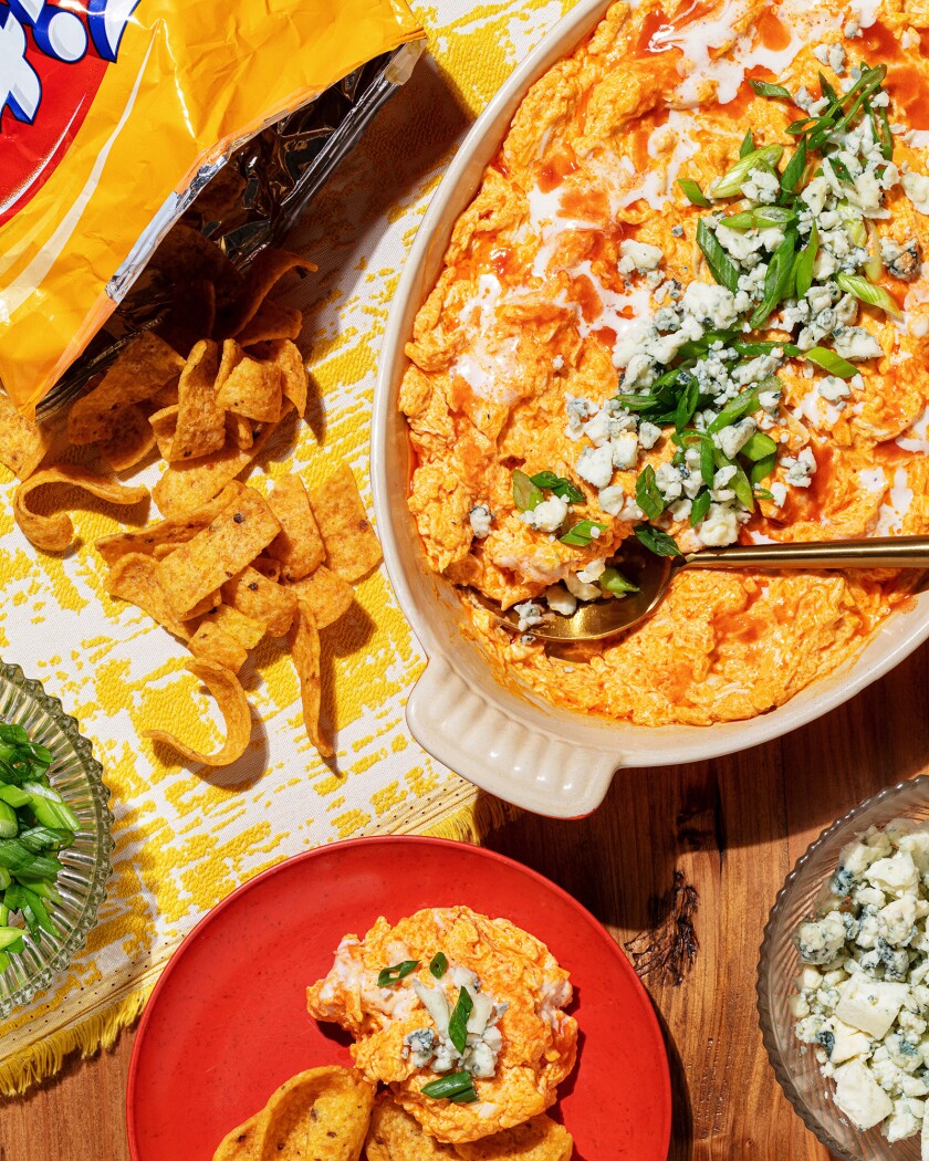 Overhead shot of buffalo chicken dip with a side of corn chips