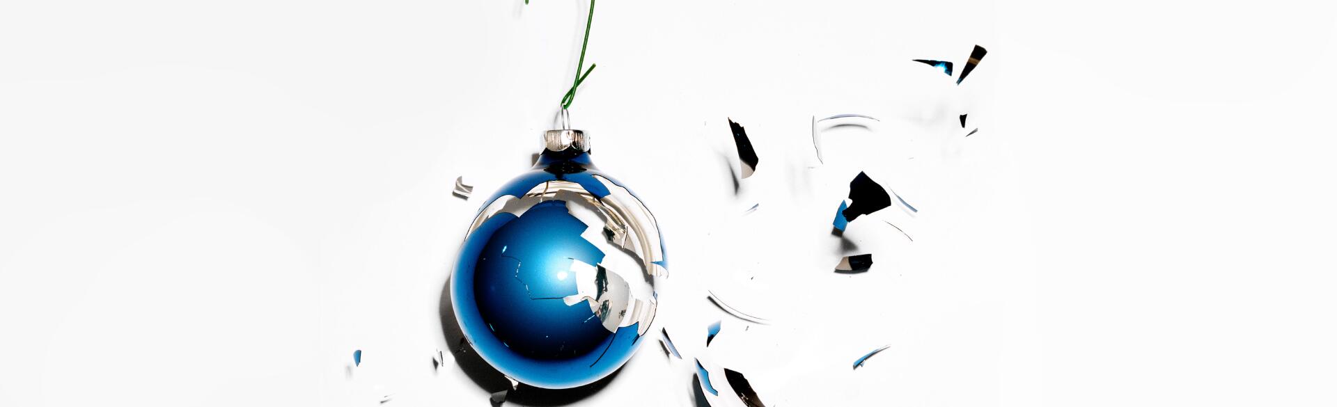 A smashed blue bulb Christmas ornament.