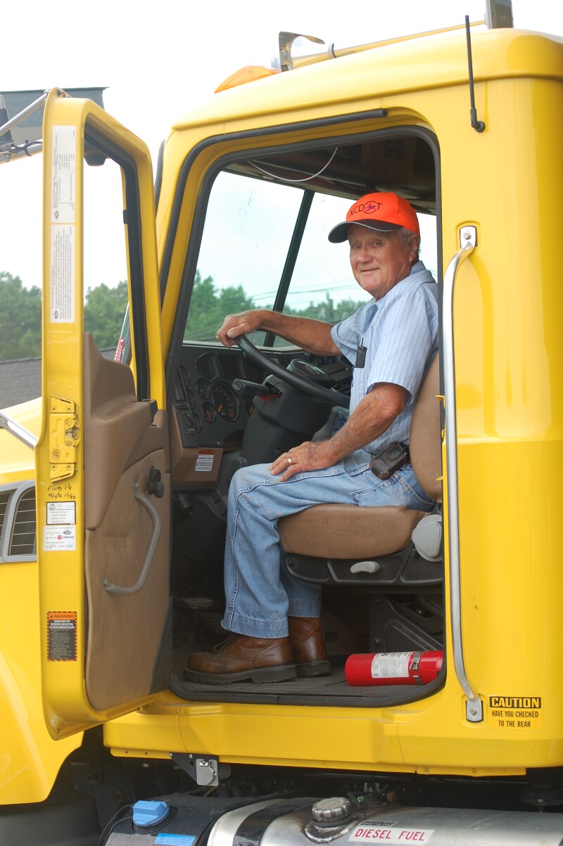 Older man in his work truck