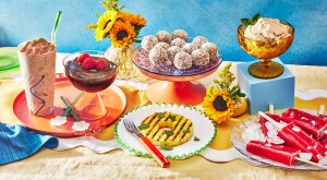 Six Summery Sugar-free dessert laid out on a table with sunflowers and bright blue background 