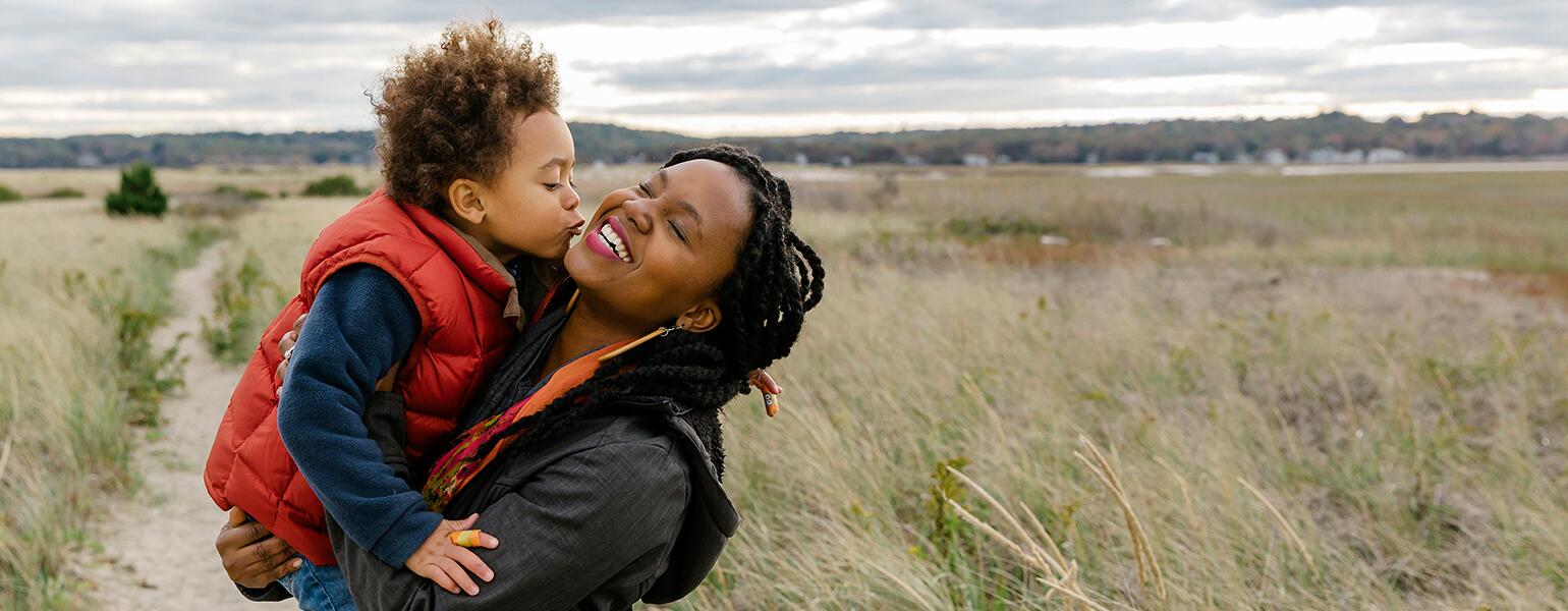 image_of_black_mother_holding_small_child_against_landscape_Stocksy_txpf9d9135aWFX200_OriginalDelivery_1284835_1540.jpg