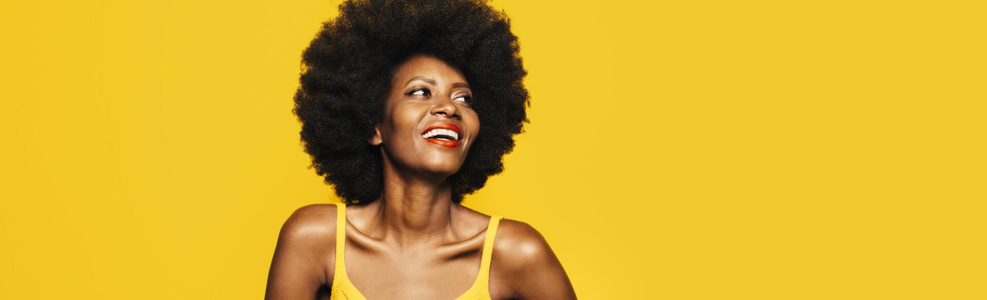 Woman smiling with healthy hair.