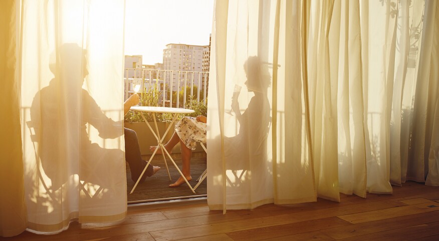 Couple in an apartment on the balcony