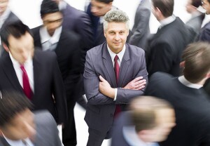 Older Job seeker standing out in crowd