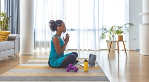 image_of_woman_meditating_with_hands_together_GettyImages-1251369317_1800