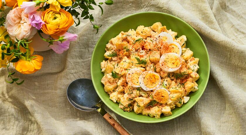 Platter of potato salad on a light surface