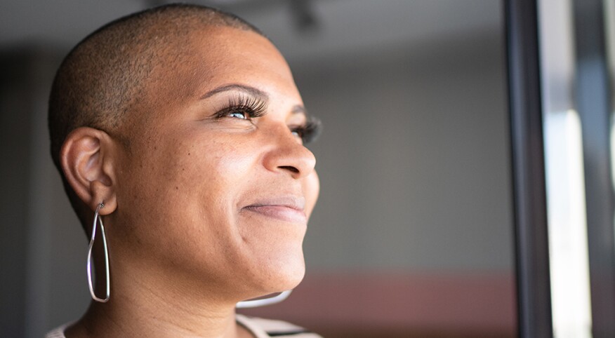 Woman looking out the window and smiling