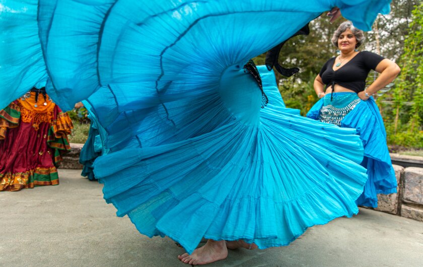 Belly Dancers skirt twirling through the frame