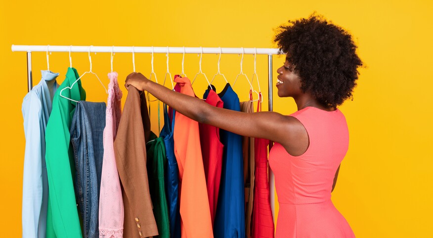 image_of_woman_looking_through_clothes_on_rack_shutterstock_1949795689_1800