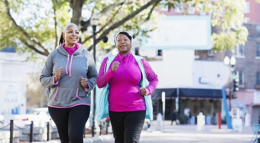 image_of_two_women_walking_outside_GettyImages-1036366490_1800