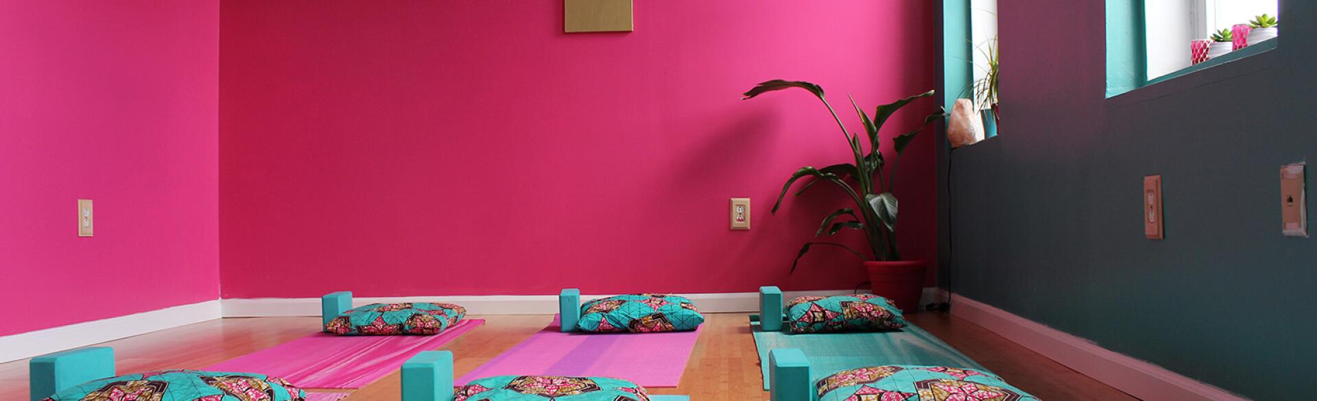 Yoga studio with mats on the floor.