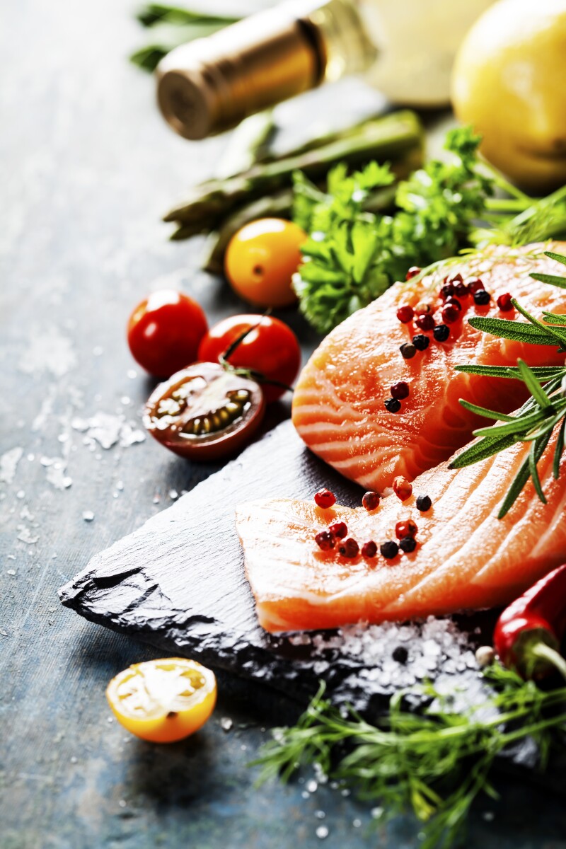 Delicious portion of fresh salmon fillet with aromatic herbs,
